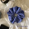 Macro view of a large blue-purple satin scrunchie showing smooth and shiny silk texture - Large Scrunchie / Blue