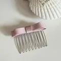Elegant pink satin bow hair comb clip for creative hair styling and fashion accessories. - Pink Bow Hair Comb