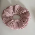 Close-up of shimmering pleated pink scrunchie with a soft metallic texture - Ruffled Scrunchie / Pink