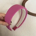 Close-up of pink wide sponge headband showing ribbed fabric texture and soft lining - Wide Padded / Rose Red Ribbed Headband