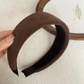 Detailed macro view of a brown ribbed fabric padded headband for women accessory - Wide Padded / Coffee Striped Headband