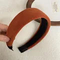 Close-up of burnt orange ribbed wide sponge headband with soft premium fabric texture - Wide Padded / Orange Ribbed Headband