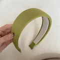 Detailed close-up of a green ribbed fabric wide sponge padded headband with soft texture - Wide Padded / Mustard Green Ribbed Headband