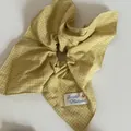 Detailed macro shot of a yellow checkered fabric scrunchie with a branded button tag - 3# Yellow Stripe Kite Hair Ring