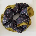 Detailed view of olive green and navy floral retro fabric scrunchie hair accessory - Yellow Floral Patchwork Scrunchie