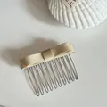 Elegant champagne satin bow hair comb with sturdy metal teeth shown in detail view - Yellow Bow Hair Comb