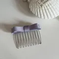 Close-up of elegant purple satin bow hair comb insert with silver metal teeth. - Purple Bow Hair Comb