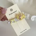 Mignonne pince à cheveux chien jaune avec nœud rose sur base blanc perlé pour femme SKU - Chien Jaune Ovale Blanc (6#)
