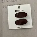 Ein Paar glänzende dunkelrote ovale Haarspangen auf einer weißen Karte für Frauen - Rote Solide Ovale Haarklammer (37#) / Ein Paar