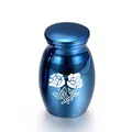 Small blue metal cremation urn for ashes with white rose pattern design. - 25*16mm / Blue