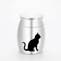 Detailed view of a silver stainless steel pet memorial urn with a black cat silhouette. - 30mm x 40mm / Silver