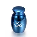 Detailed view of blue metallic memorial urn with engraved bird patterns for ashes - Blue (25x16mm)