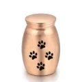 Elegante urna para cenizas de mascotas en metal oro rosa con diseño de huellas negras - Oro Rosa (25*16mm)