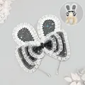 Sweet Lolita rabbit ear headband with starry pattern and a layered lace bow detail - Black