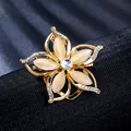 Macro view of a luxury golden flower brooch featuring cat-eye stones and rhinestones - Flower (XD825287)
