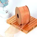 Close-up of orange sheer organza ribbon on a spool for elegant gift wrapping detail - 4CM Wide x 9.14 Meters Long / Bright Yellow