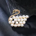 Elegant golden swan brooch pin featuring clusters of lustrous white pearls for women - Swan Style / Gold Pearl Swan