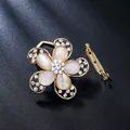 Elegant gold floral brooch pin with white cat-eye stones and sparkling rhinestones. - Opal Flower Style (XD825286)