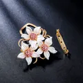 Elegant gold brooch pin featuring three white flowers with sparkling pink crystals - Three Flowers Style (XD825288)