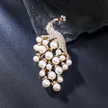 Elegant golden peacock brooch decorated with white pearls and sparkling crystals for women - Pearl Peacock Style (XD825296)