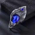 Vintage Silberblatt-Brosche mit blauem Kristall für elegante Anzüge und Kleider. - Königsblau