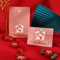 Elegant pink Christmas greeting card featuring gold foil text and cute snowman motif - Snowman