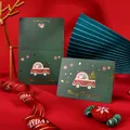 Vintage dark green Christmas greeting cards with gold foil Merry Christmas text design - Santa Giving Gifts