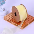 Pale yellow sheer organza ribbon roll on a wooden pallet for romantic gift wrapping - 4CM Wide x 9.14 Meters Long / Orioles Yellow
