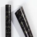 Vergulde Merry Christmas cadeaupapierrol in elegant zwart en goud - Zwartgouden Letters