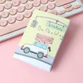 Cute ins-style folded greeting card with travel illustration on pink desk setup - Car