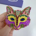 Detail of a vintage colorful cat head brooch with enamel and vibrant rhinestones - Antique Gold, Purple Pink Fox Head