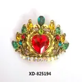 Close-up of vintage crown brooch with colorful crystals and red heart center - Antique Gold, Colorful Crown