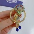 Detailed macro view of a colorful bird brooch with multi-colored rhinestones - KC Gold, Parrot