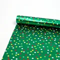 Vibrant green metallic gift wrapping paper roll featuring multi-colored festive polka dots - Pine Dance (Green Multicolor Dots)