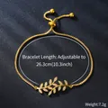 Detailed macro shot of an adjustable gold bracelet featuring a sparkling zircon leaf motif - Leaf Style (SL350-2)