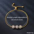 Detail of gold-plated copper bracelet with three cubic zirconia flower charms. - Three Daisy Flowers Style (SL372-2)
