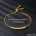 Close-up of elegant adjustable gold bracelet with sparkling zircon stones and weight. - Rectangular Zirconia Row Style (SL324-2)