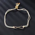 Elegant adjustable white string bracelet with gold infinity symbol and cubic zirconia - Infinity Symbol Style (SL217-8) / Gold/Off-white