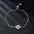Elegant silver-toned box chain bracelet with sparkling zircon smiley key charm. - Key and Smile (SL344-1)