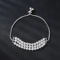 Adjustable silver-toned bracelet with triple-row cubic zirconia flower clusters - Three Row Flower Cluster Crescent Style (SL204-1)