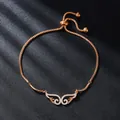 Elegant rose gold wing bracelet with cubic zirconia stones and adjustable bolo clasp - Angel Wings (SL345-3)