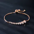 Elegant adjustable rose gold bolo bracelet featuring sparkling clear cubic zirconia - 9 Gradient Zirconias Style (SL333-3)
