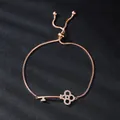 Exquisite rose gold key bracelet with zircon flower detail and adjustable chain - Symmetrical Hollow Key Style (SL239-3)