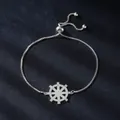 Elegant silver adjustable bracelet featuring a micro-pave zircon ship's wheel charm SKU - Rudder Design Style (SL337-1)