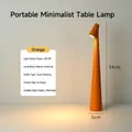 Modern orange LED rechargeable desk lamp with minimalist aluminum cone design for bedroom. - 3-Color Dimming (With Charger) / Aluminum Material / Orange