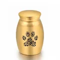Small gold pet cremation urn with paw print design for ashes - Gold