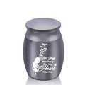Small gray stainless steel memorial urn featuring engraved feather and birds pattern - Black