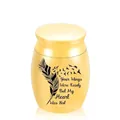 Elegant golden mini cremation urn for pet ashes with feather and bird memorial design - Gold