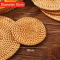 Natural handmade 10cm round woven rattan coaster providing heat insulation for glasses - Rattan Mat / Diameter 10cm