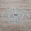 Detailed view of French lace embroidery and hollow floral pattern on oval tablecloth - 44*71cm / Camel